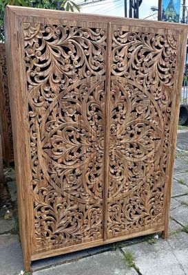 Bali style wardrobe with complex carvings.