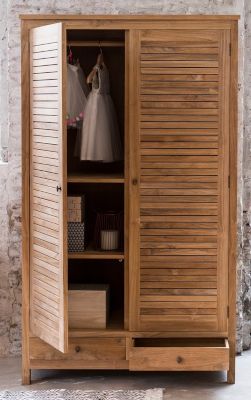 A wardrobe with two integrated drawers underneath.